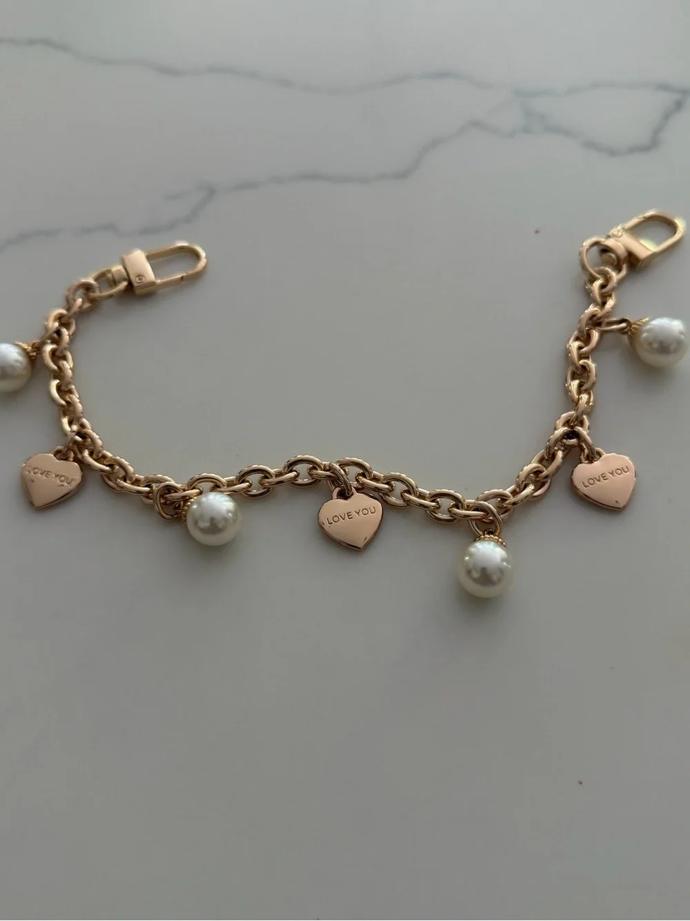 Bag Chain - gold tone with faux pearls and hearts that say “ Iove you”